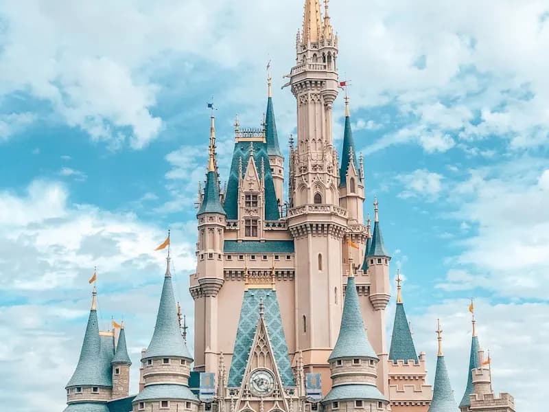 Cinderella Castle above clouds and blue sky