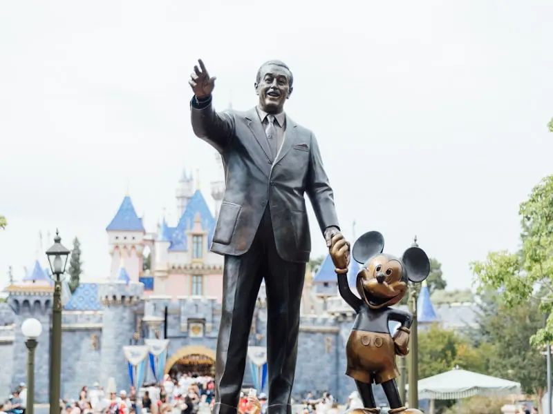 Partners statue of Walt Disney and Mickey Mouse in front of Sleeping Beauty Castle